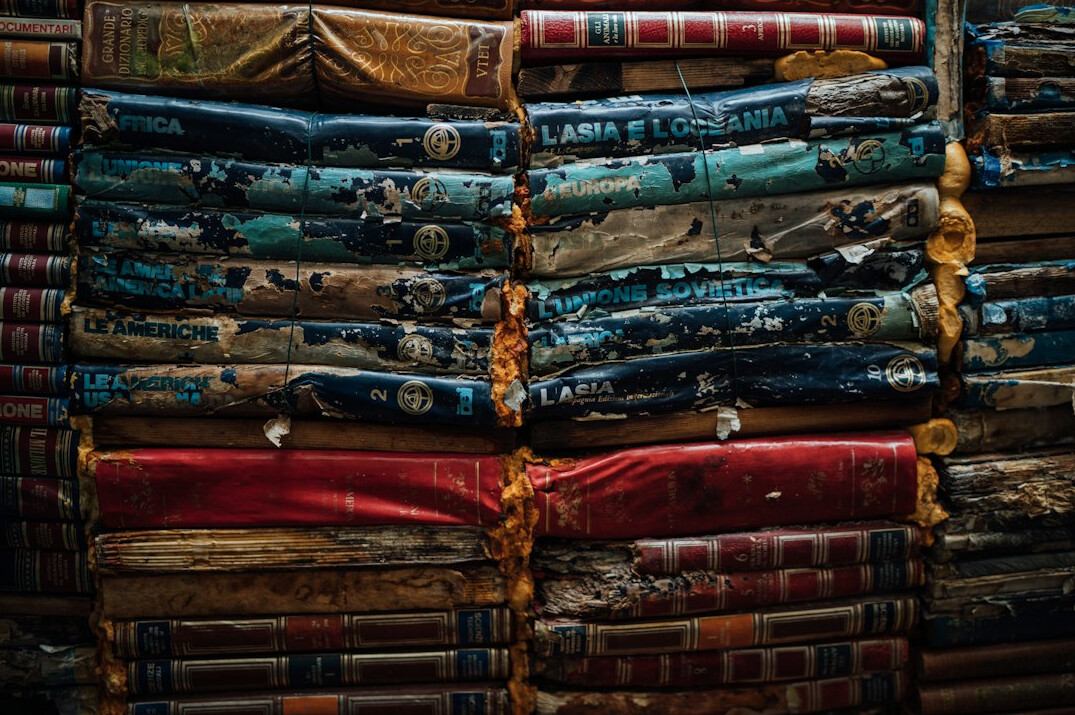 Stack of old books with worn covers