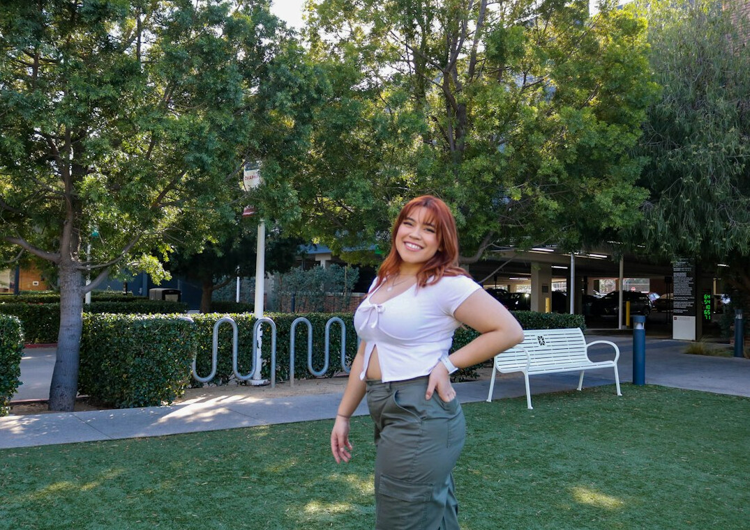 Portrait of a smiling Latina woman editor in her thirties