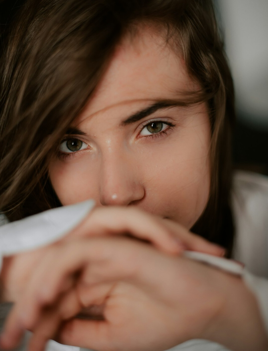 Portrait of a young woman writer with brown hair
