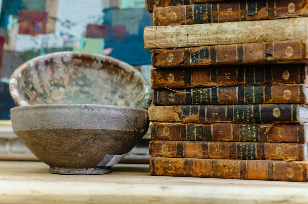 Old books and archive volumes on a table