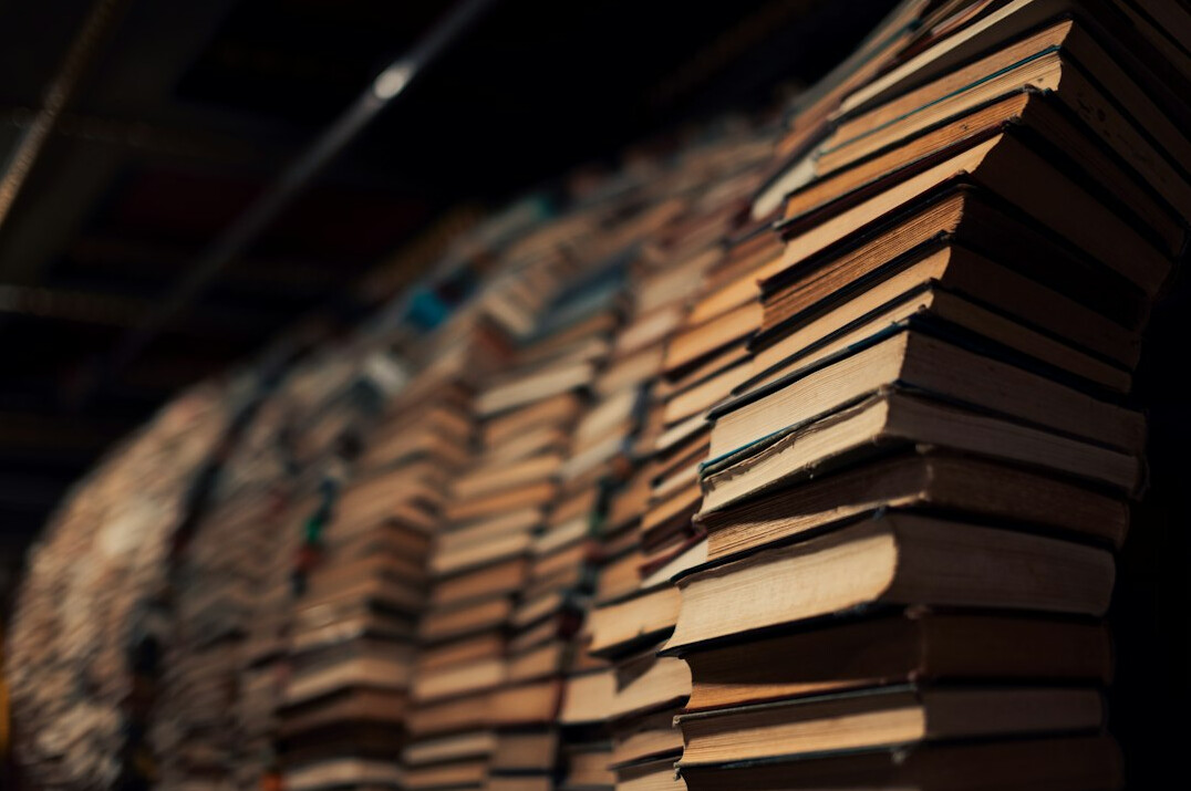 Rows of old books on a shelf